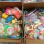 Box filled with collectible McDonald's and Burger King Happy Meal Toys