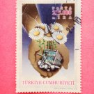 Postage Stamp with an open hand and international thank you message drawn on it
