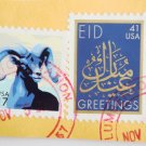 Partial Envelope with several United States Postage Stamps about Eid and Ink Postmark on it