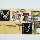 Partial Envelope with six United States Postage Stamps and Ink Postmark on it