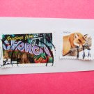 Two United States Postage Stamps Greetings from Georgia and Red Fox