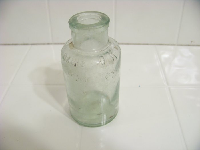 Embossed Davis OK baking powder bottle