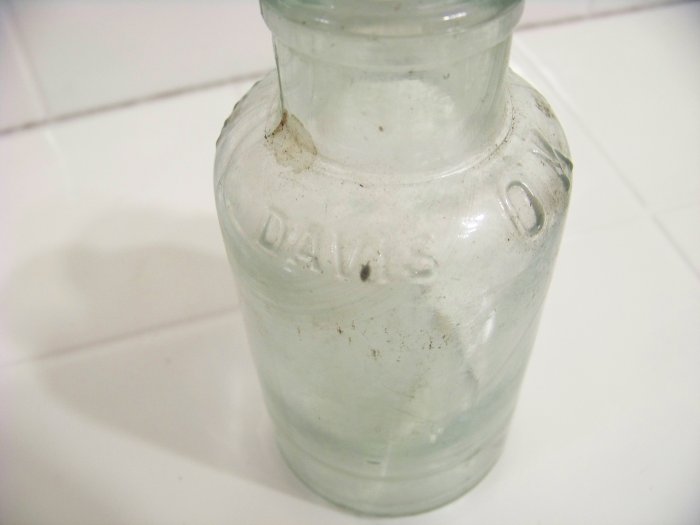 Embossed Davis OK baking powder bottle