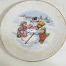 a child's Christmas plate 1986 Avon porcelain trimmed in gold