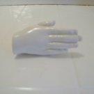 white hand shaped bottle stopper