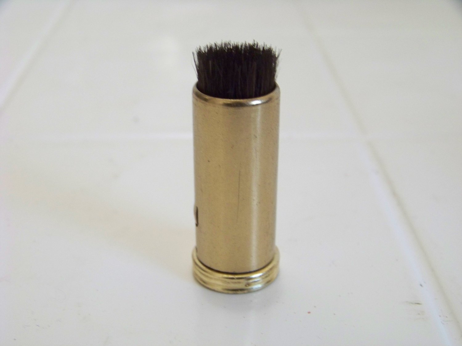 vintage retractable camera lens brush