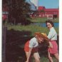 TWO CUTE FARMERETTES CROSSING A BARBED WIRE -P/C -C-254
