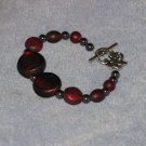 burgandy and black bracelet handcrafted one of a kind