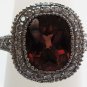 Sunstone Ring with Elegant Diamond Setting