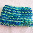 Hand-knitted doll hat, blue and green