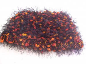 Hand-knitted ladies hat, black with orange
