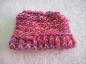 Hand-knitted doll hat, pink