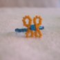 Butterfly ring, orange on blue