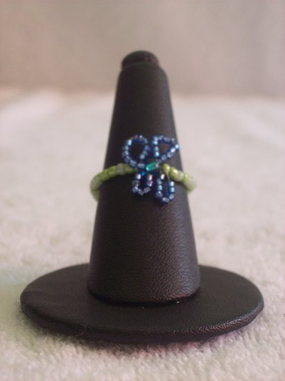 Butterfly ring, dark blue on various green