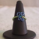 Butterfly ring, dark blue on various green