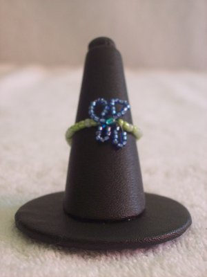 Butterfly ring, dark blue on various green