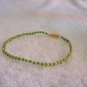 Beaded bracelet, green and yellow
