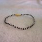 Beaded bracelet, black and clear