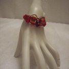Abstract glass beads on burgundy square