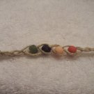 Wish bracelet (on tan, in vintage colors) - red, yellow, navy, green