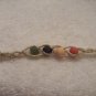 Wish bracelet (on tan, in vintage colors) - red, yellow, navy, green