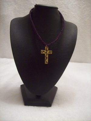 Gold floral cross on purple square