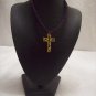 Gold floral cross on purple square