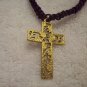 Gold floral cross on purple square