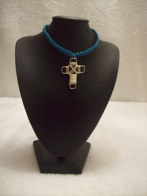 Silver wire cross on royal blue square