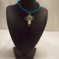 Silver wire cross on royal blue square