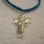 Silver wire cross on royal blue square