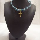Gold cross on blue and turquoise square/switchback