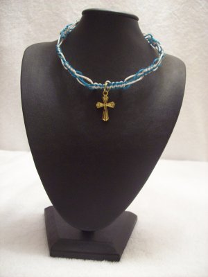 Gold cross on blue and turquoise square/switchback