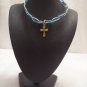 Gold cross on blue and turquoise square/switchback