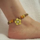 Yellow flower with wood beads on brown square