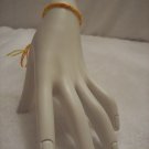 Yellow and orange braided wrap