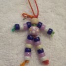 Flower bead (purple), tan, dark blue, purple, white