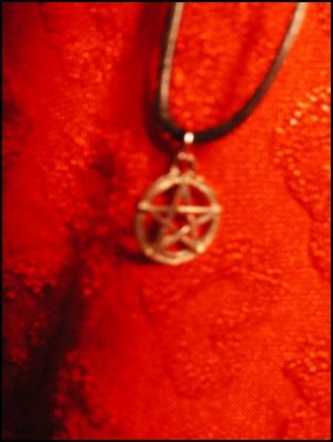 SILVER-TONED UPRIGHT PENTACLE CHARM ON CORD