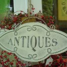 PRIMITIVE METAL ANTIQUES SIGN WITH JUTE HANGER