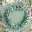 Multi gemstones and freshwater cultured white pearls in sterling sliver bracelet. 9’’