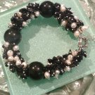 Multi gemstones and freshwater cultured white pearls in sterling sliver bracelet. 9’’