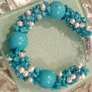 Multi gemstones and freshwater cultured white pearls in sterling sliver bracelet. 9’’