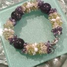 Multi gemstones and freshwater cultured white pearls in sterling sliver bracelet. 9’’