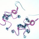 Pink adjustable figure earrings