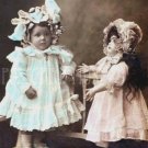 GIRL WITH A BISQUE DOLL Antique Photo Postcard Reproduction