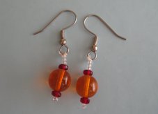 Large Orange Balls with tiny Red Beads