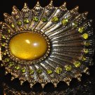 Yellowish-green oval-shaped stone with green crysral bangle B1001