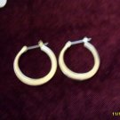 silver hoops pierced