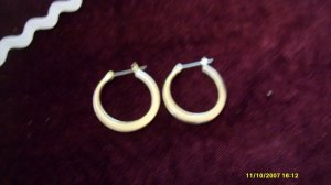 silver hoops pierced