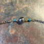 Silvertone And Turquoise Colored Bead Religious Pendant Necklace